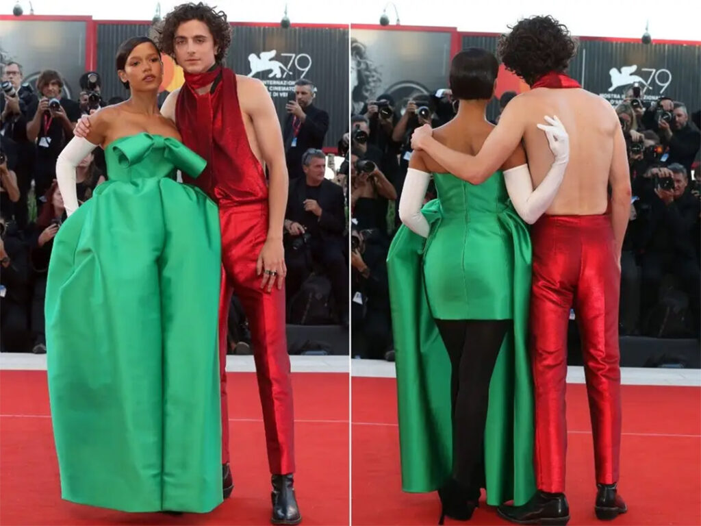 Taylor Russell และ Timothee Chalamet (ในจั๊มป์สูทเปลือยหลังจาก Haider Ackermann)